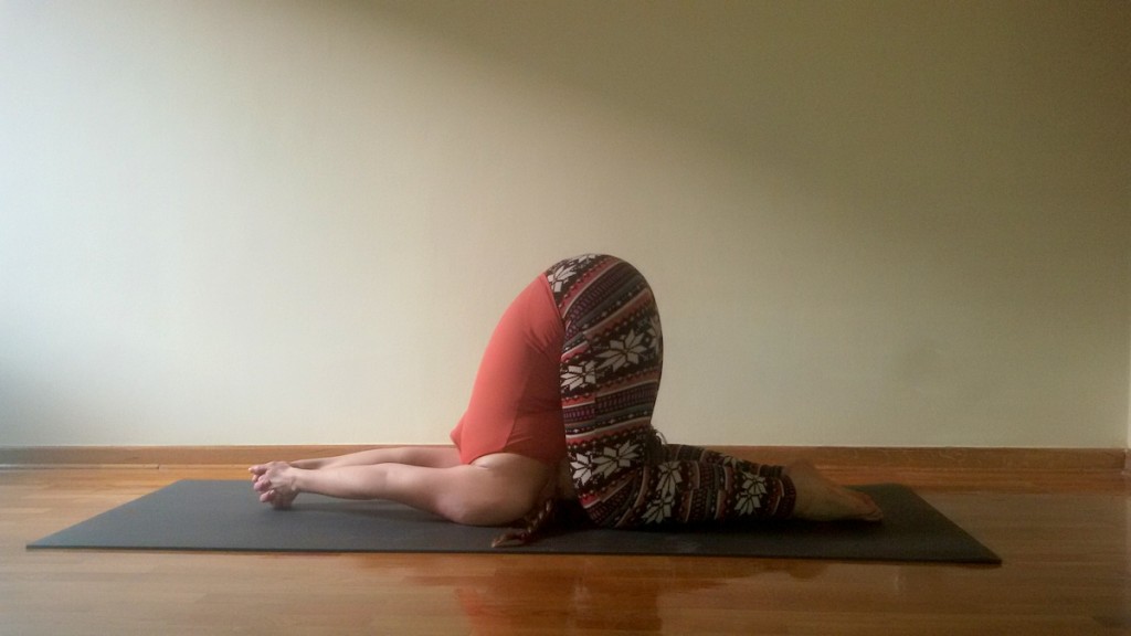 karnapidasana